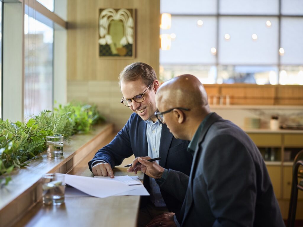 Looking over the contract with a member of choice hotels development